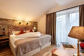 ALMA Appartement HERBST Schlafzimmer 1
