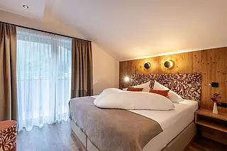 ALMA Appartement HERBST Schlafzimmer 2