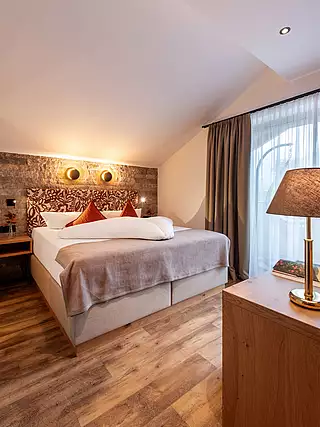 ALMA Appartement HERBST Schlafzimmer 1
